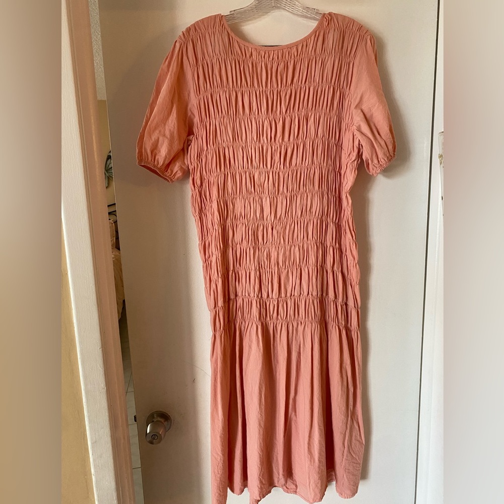 Women’s smocked midi dress in pink. One size fits most